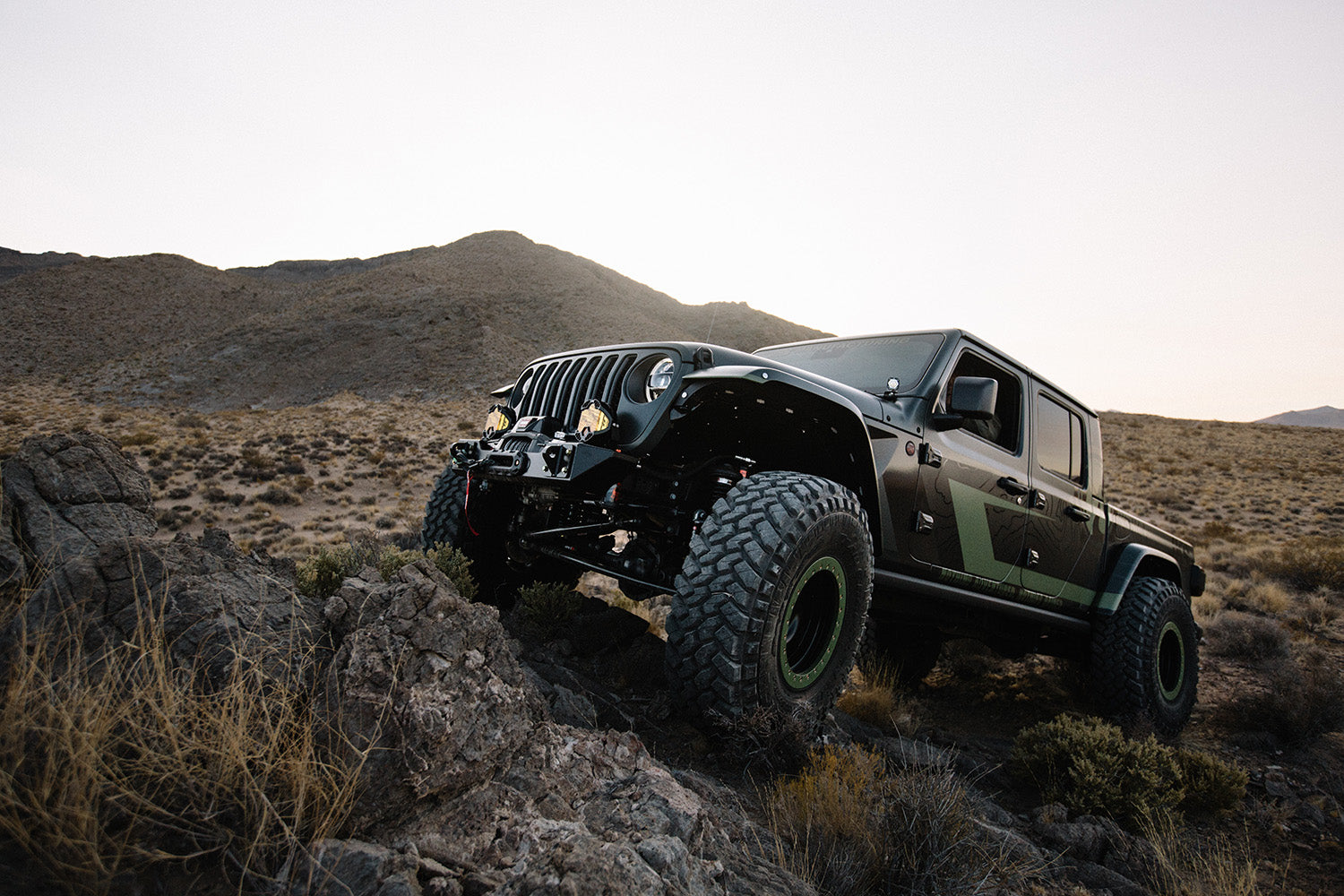 Spartacus parked on some rocks below a mountain
